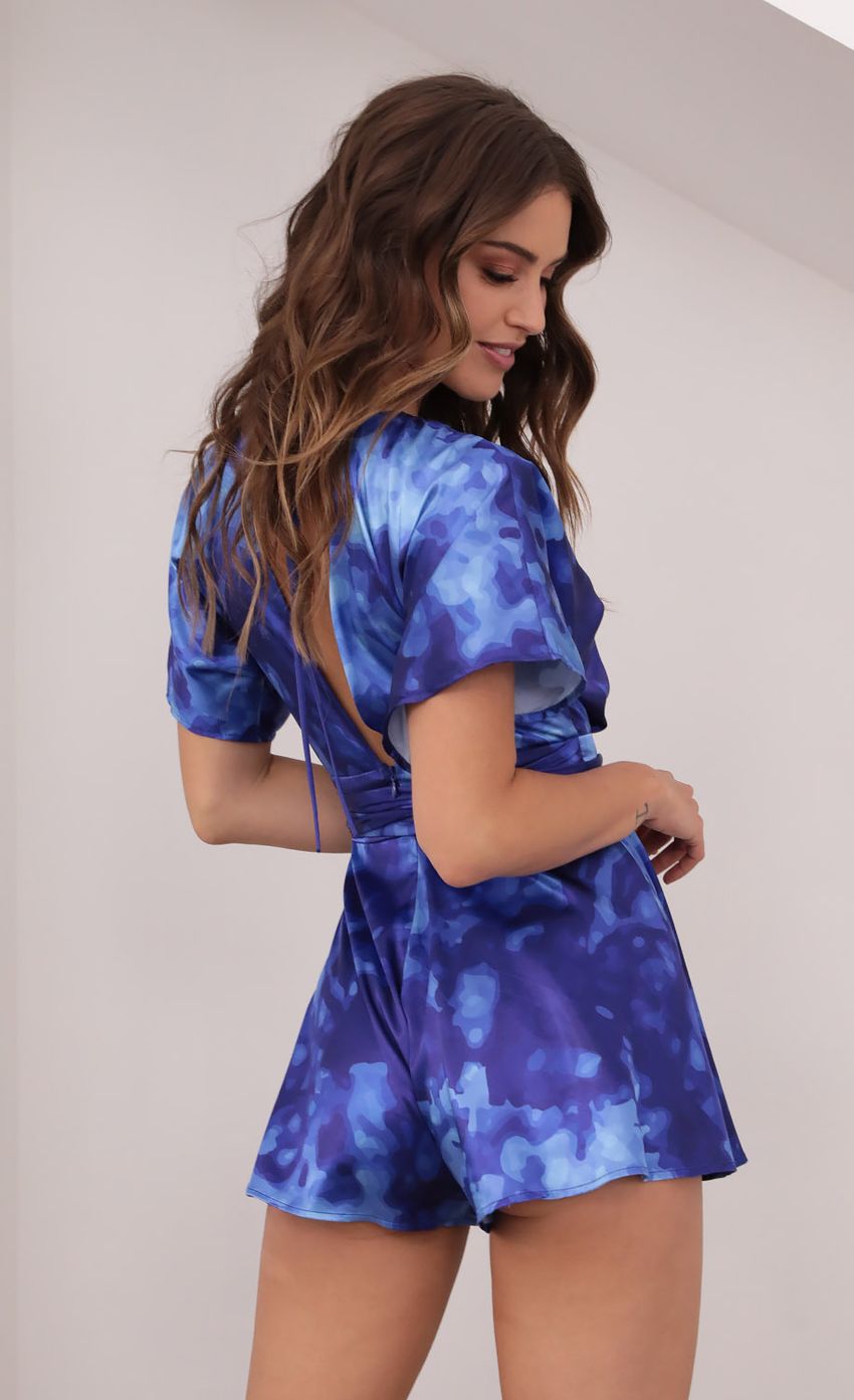 Picture Feeling The Night Satin Romper in Abstract Shades of Blue. Source: https://media-img.lucyinthesky.com/data/Mar21_2/850xAUTO/1V9A5747.JPG