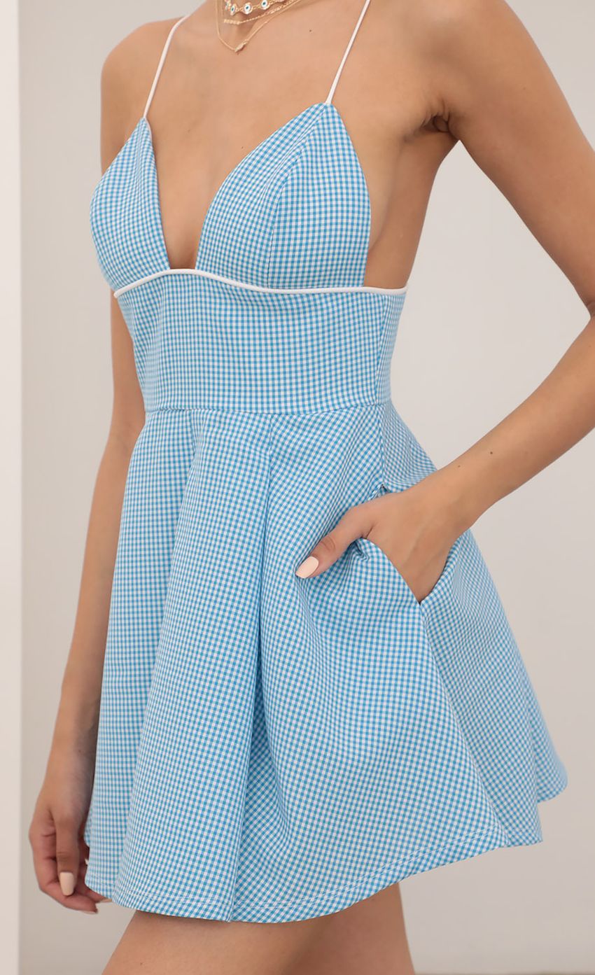 Picture Pleated Dress in Gingham Blue. Source: https://media-img.lucyinthesky.com/data/Mar21_2/850xAUTO/AT2A6336.JPG