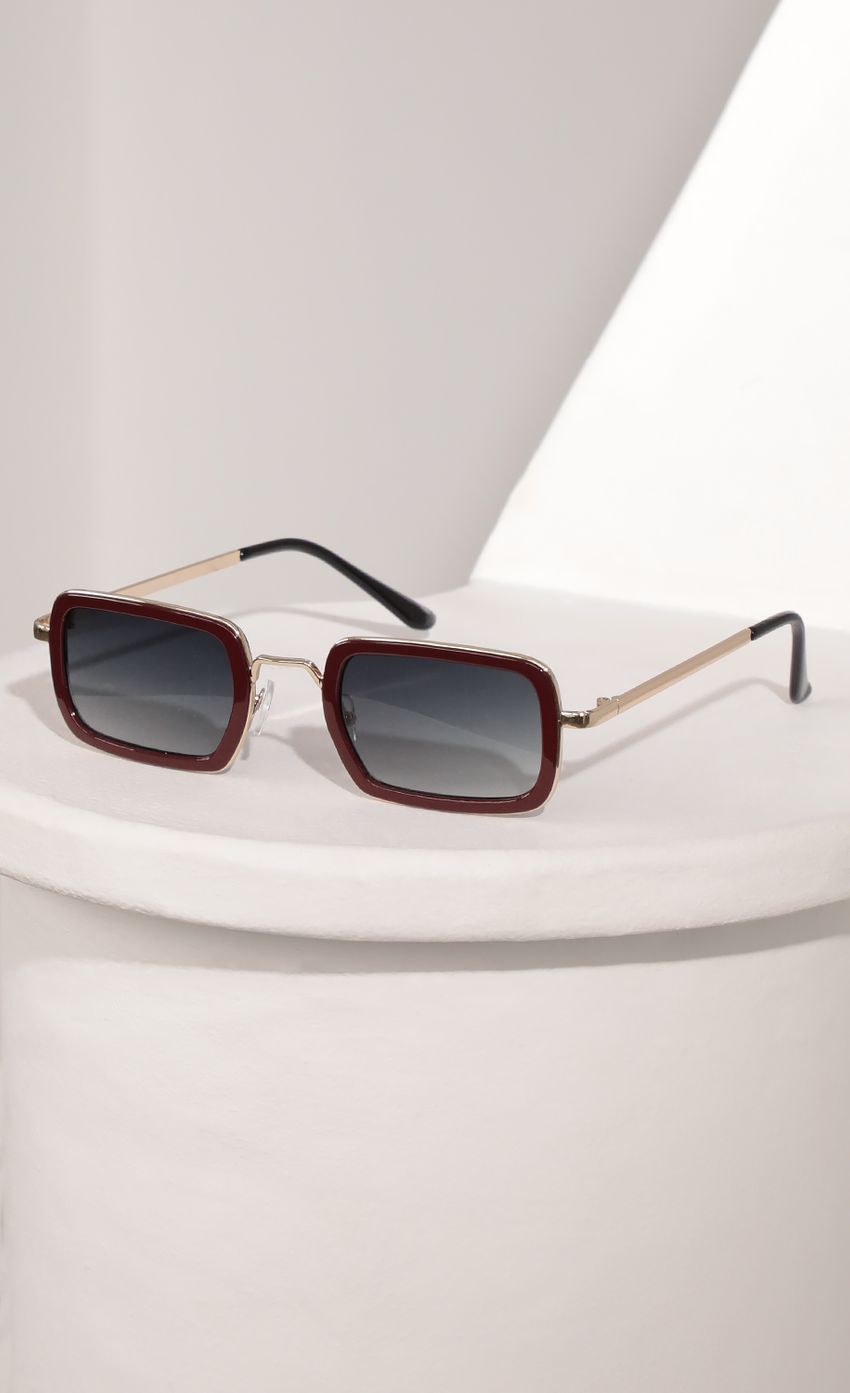 Picture Rectangle Sunglasses with Burgundy Bevelled Edge Lenses. Source: https://media-img.lucyinthesky.com/data/Mar21_2/850xAUTO/AT2A9409.JPG