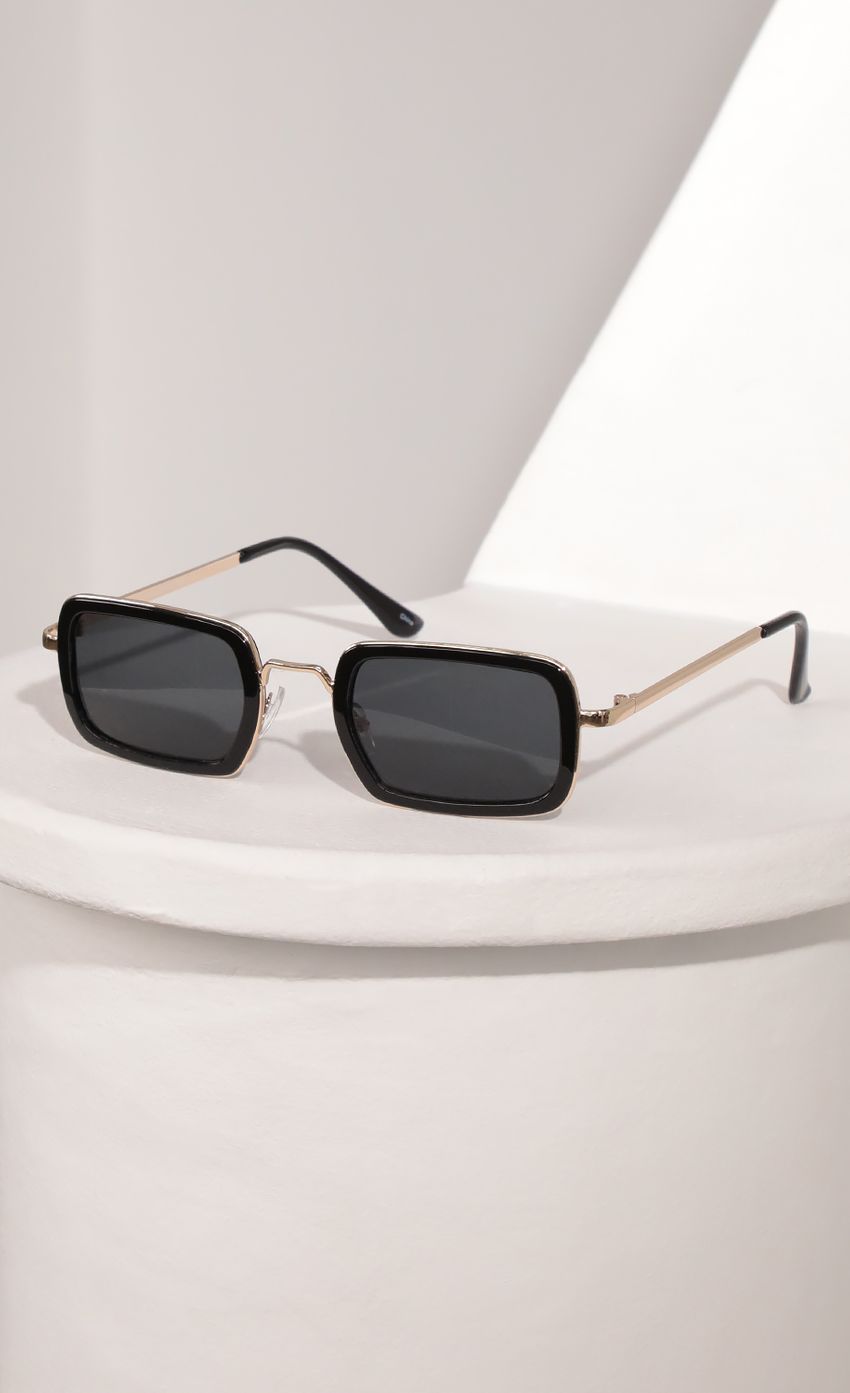 Picture Rectangle Sunglasses with Black Bevelled Edge Lenses. Source: https://media-img.lucyinthesky.com/data/Mar21_2/850xAUTO/AT2A9412.JPG