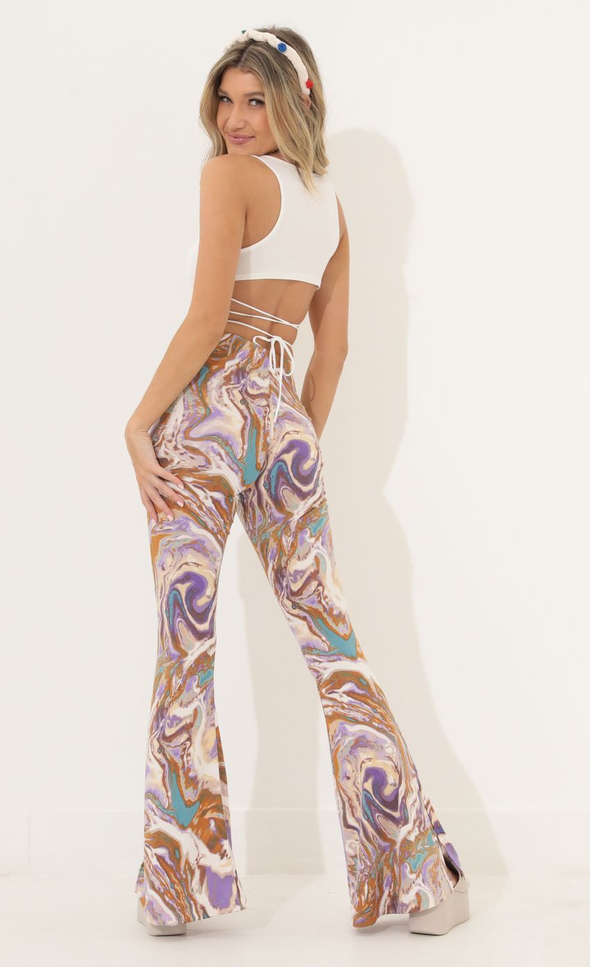 Picture Pant in Swirl Purple Multi. Source: https://media-img.lucyinthesky.com/data/Mar22_2/850xAUTO/1V9A8831.JPG