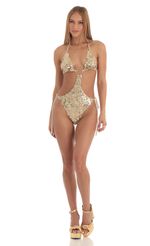 Picture Sequin O-Ring Monokini in Gold. Source: https://media-img.lucyinthesky.com/data/Mar23/150xAUTO/4e650617-f688-418a-8301-c8bfc8d5d548.jpg