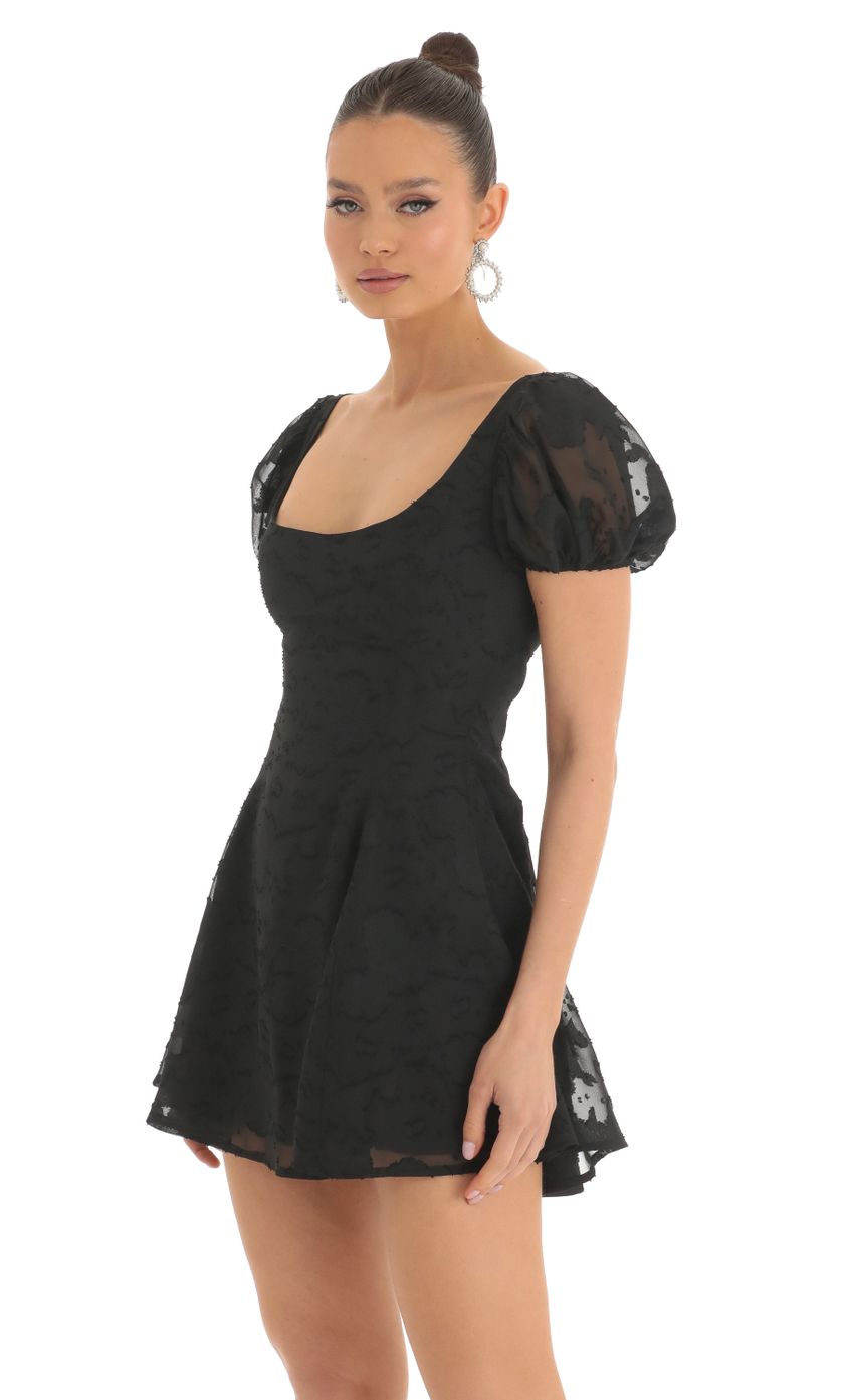 Picture Floral Puff Sleeve Dress in Black. Source: https://media-img.lucyinthesky.com/data/Mar23/850xAUTO/4bdf4aff-d38d-4851-94aa-5235c1a052d2.jpg