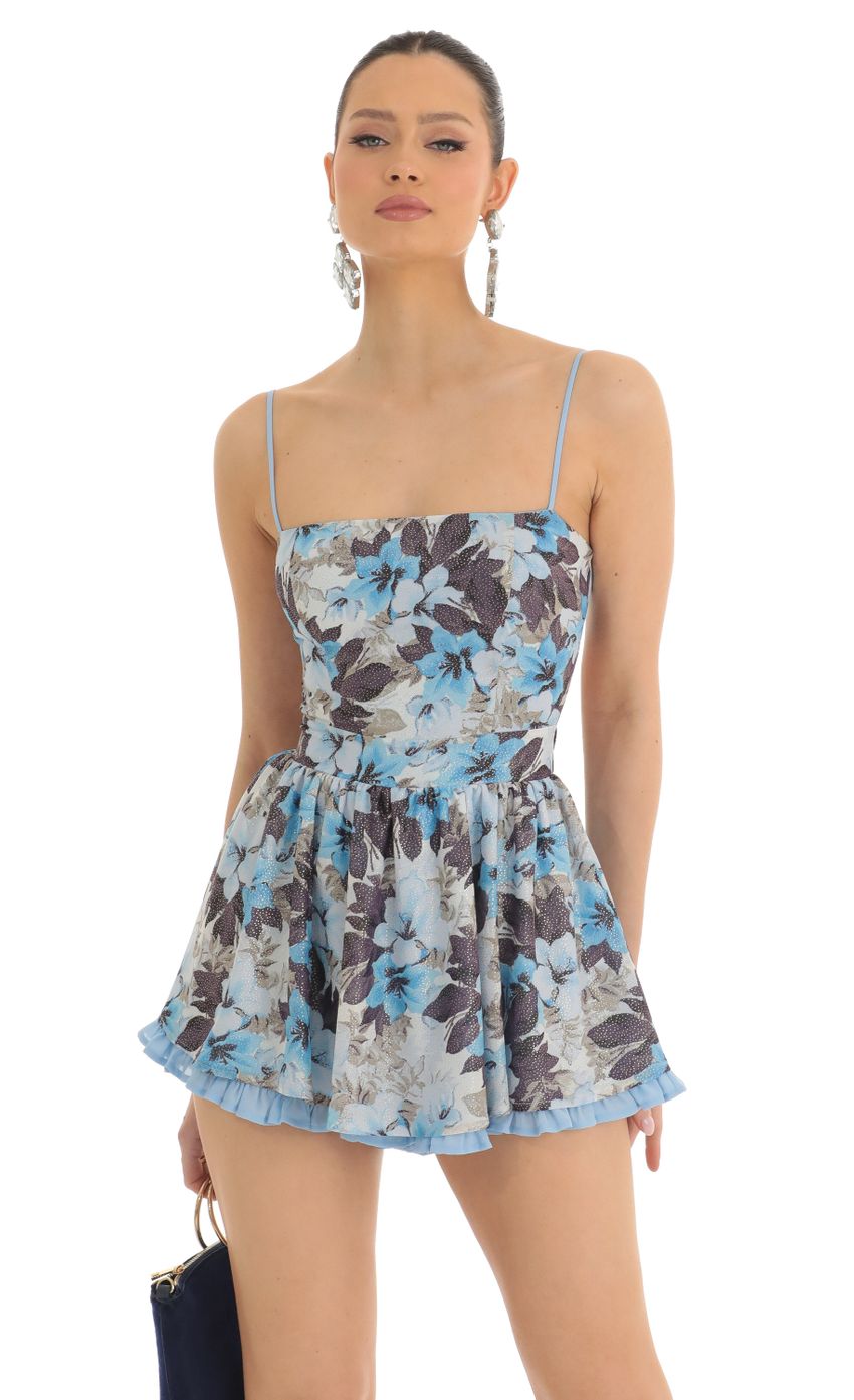 Picture Jeselle Floral Shimmer Romper in Blue. Source: https://media-img.lucyinthesky.com/data/Mar23/850xAUTO/91342719-0b26-4f58-b073-9a2947ac8ae0.jpg