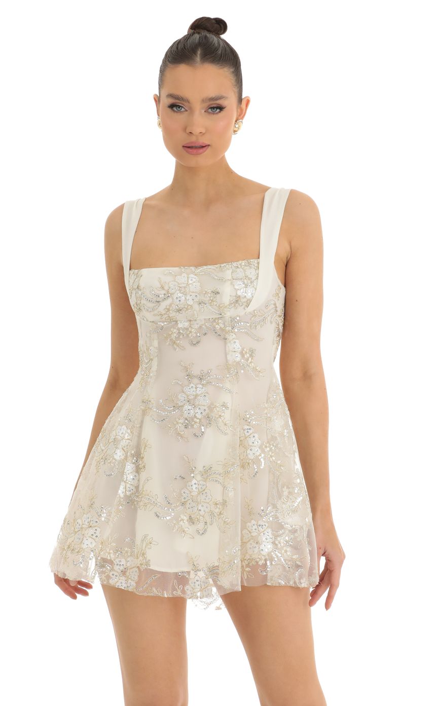 Picture Floral Sequin Tulle Dress in White. Source: https://media-img.lucyinthesky.com/data/Mar23/850xAUTO/c31a86b0-0ade-47ec-be63-d28398c10788.jpg