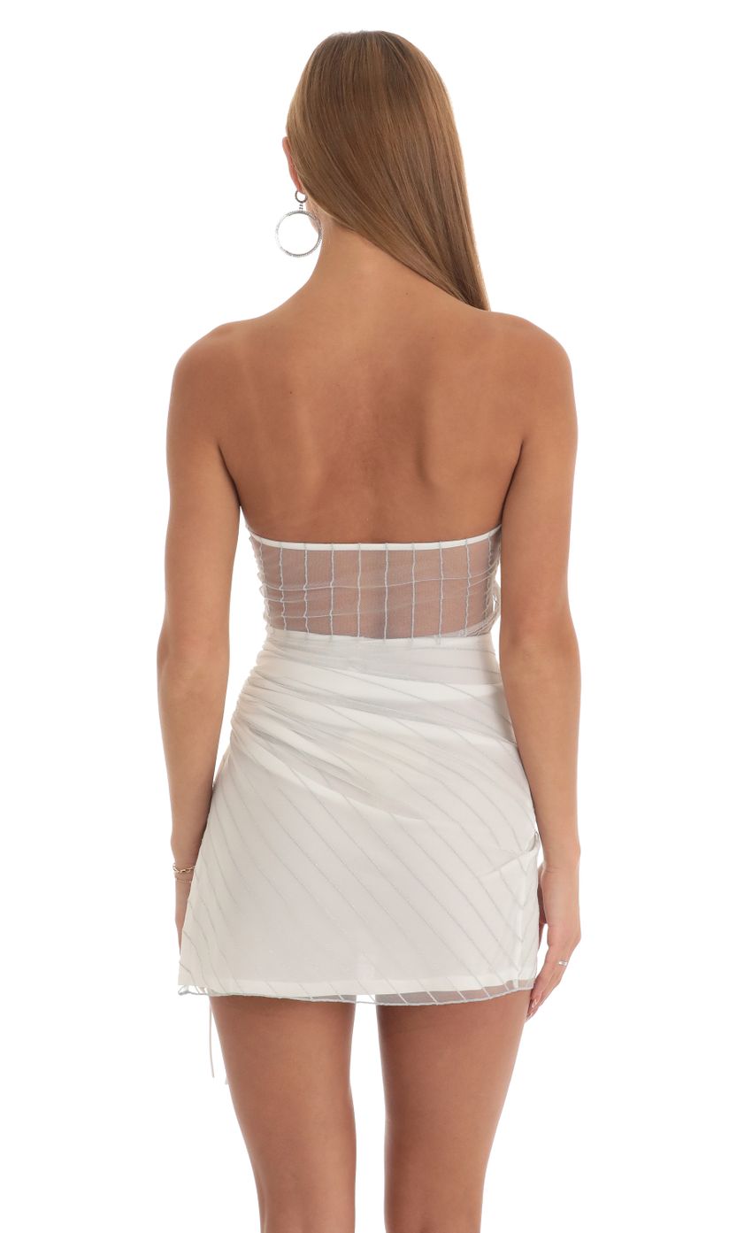 Picture Shimmer Striped Strapless Dress in White. Source: https://media-img.lucyinthesky.com/data/Mar23/850xAUTO/ffb206b7-dcc8-495c-a8ff-713673634f5c.jpg