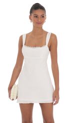 Picture Lace Trim Open Back Dress in White. Source: https://media-img.lucyinthesky.com/data/Mar24/150xAUTO/0de38b0f-fd57-4d02-8e54-b7fd2686f822.jpg