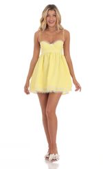 Picture Gingham Lace Babydoll Dress in Yellow. Source: https://media-img.lucyinthesky.com/data/Mar24/150xAUTO/11400389-376a-450b-ab1f-3c67eedd9da9.jpg