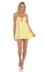 Picture Front Tie Babydoll Dress in Yellow. Source: https://media-img.lucyinthesky.com/data/Mar24/150xAUTO/383d08fb-6c24-4cfc-a000-003c89f6acf9.jpg