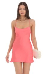 Picture Satin Open Back Slip Dress in Coral. Source: https://media-img.lucyinthesky.com/data/Mar24/150xAUTO/4657d80d-f704-4f49-8889-fd6231382c9b.jpg