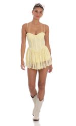 Picture Lace Corset Romper in Yellow. Source: https://media-img.lucyinthesky.com/data/Mar24/150xAUTO/5d2714c3-00d5-4cd8-ba94-3d39732bcd54.jpg