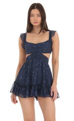 Picture Floral Ruffle Cutout Dress in Navy. Source: https://media-img.lucyinthesky.com/data/Mar24/150xAUTO/79b1898d-1c40-4229-a345-af1424362752.jpg