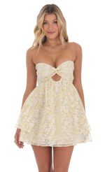 Picture Floral Shimmer Cutout Babydoll Dress in Yellow. Source: https://media-img.lucyinthesky.com/data/Mar24/150xAUTO/be627314-c870-42ae-b34e-8daae8b32b9b.jpg