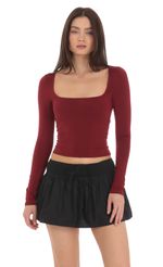Picture Scoop Neck Long Sleeve Top in Maroon. Source: https://media-img.lucyinthesky.com/data/Mar24/150xAUTO/f3f26d79-1e22-43d5-ada8-becd11494135.jpg