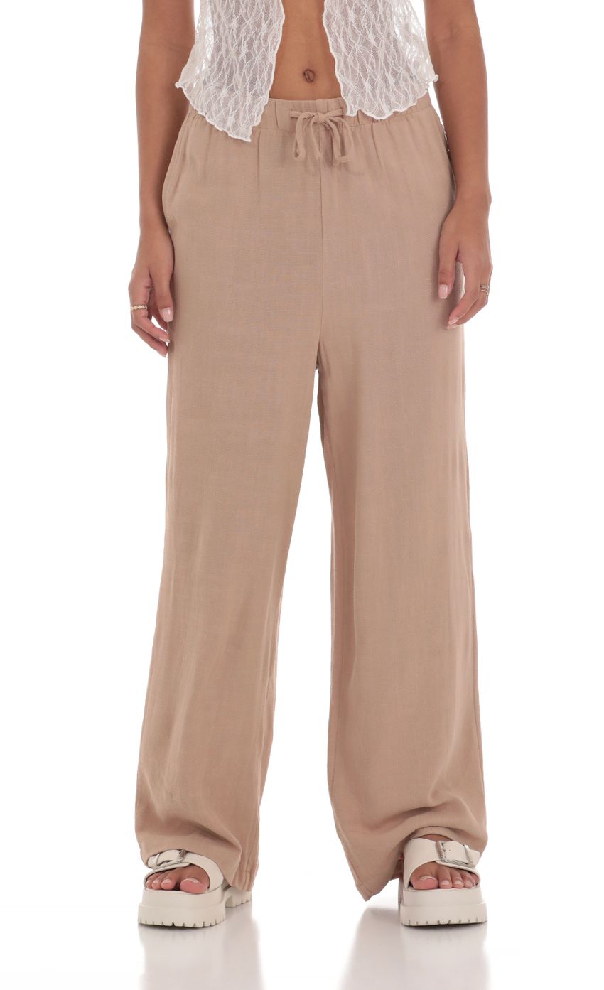 Picture Relaxed Wide Leg Pants in Tan. Source: https://media-img.lucyinthesky.com/data/Mar24/850xAUTO/02fcee92-ad24-422a-a08b-ead857e69f18.jpg