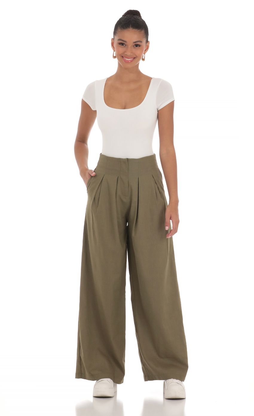 Picture Linen Pleated Pants in Olive. Source: https://media-img.lucyinthesky.com/data/Mar24/850xAUTO/037099ea-e1a7-421c-938f-27bbef820bf5.jpg