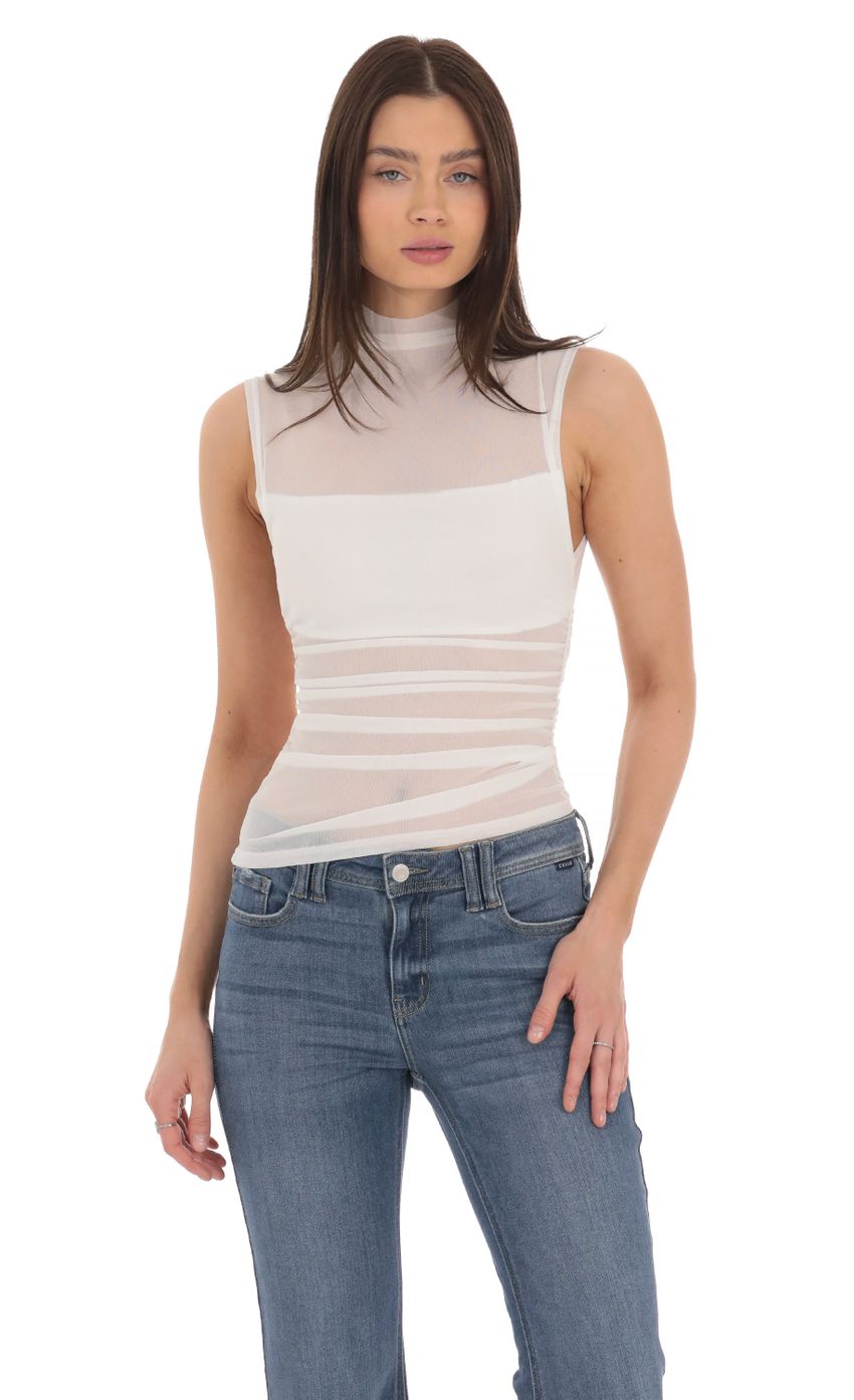 Picture Mesh Mock Neck Top in White. Source: https://media-img.lucyinthesky.com/data/Mar24/850xAUTO/0617bc33-a088-47b3-94bd-2ed2bef93cae.jpg