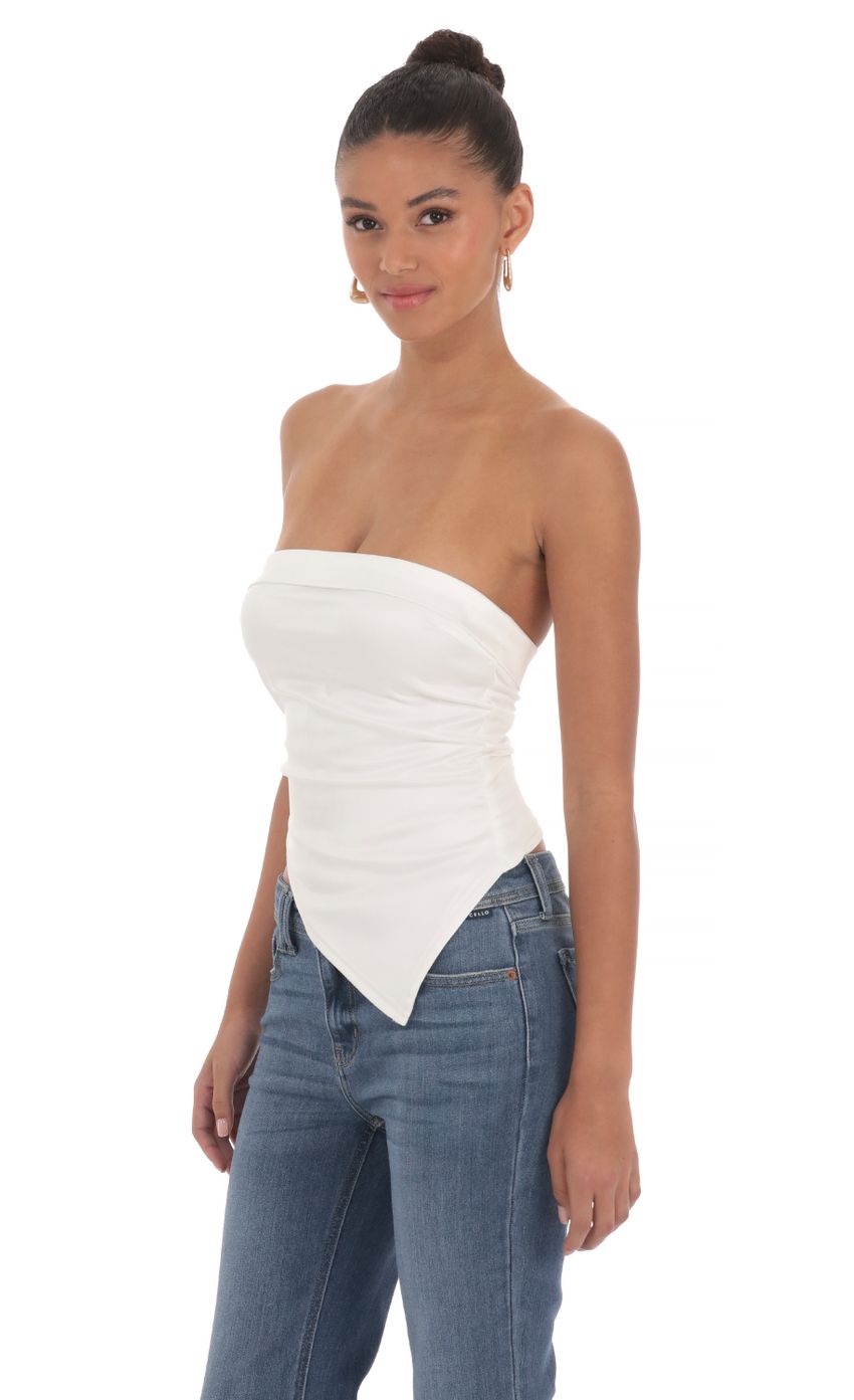 Picture Strapless Asymmetrical Top in White. Source: https://media-img.lucyinthesky.com/data/Mar24/850xAUTO/06fe6175-268f-4008-870d-14aa4b59ea96.jpg