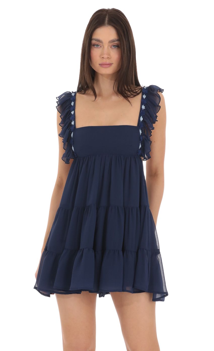 Picture Floral Ruffle Strap Babydoll Romper in Navy. Source: https://media-img.lucyinthesky.com/data/Mar24/850xAUTO/08fc1c60-387b-4701-aba5-03fad2787f8b.jpg