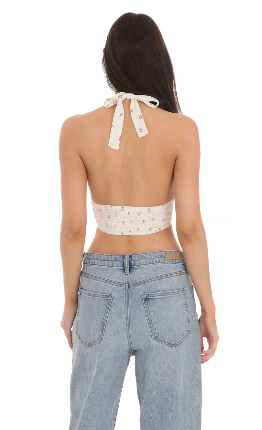 Picture Floral Front Tie Halter Top in White. Source: https://media-img.lucyinthesky.com/data/Mar24/850xAUTO/0b11c1ce-27c3-48f7-85b0-988e44f4bcf7.jpg