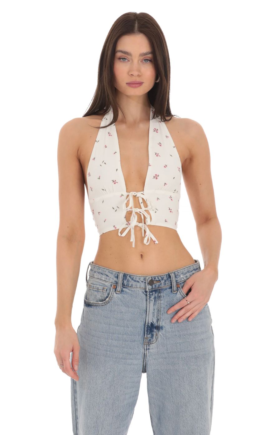 Picture Floral Front Tie Halter Top in White. Source: https://media-img.lucyinthesky.com/data/Mar24/850xAUTO/0dad8c72-7093-4e4c-b618-24ade960894e.jpg