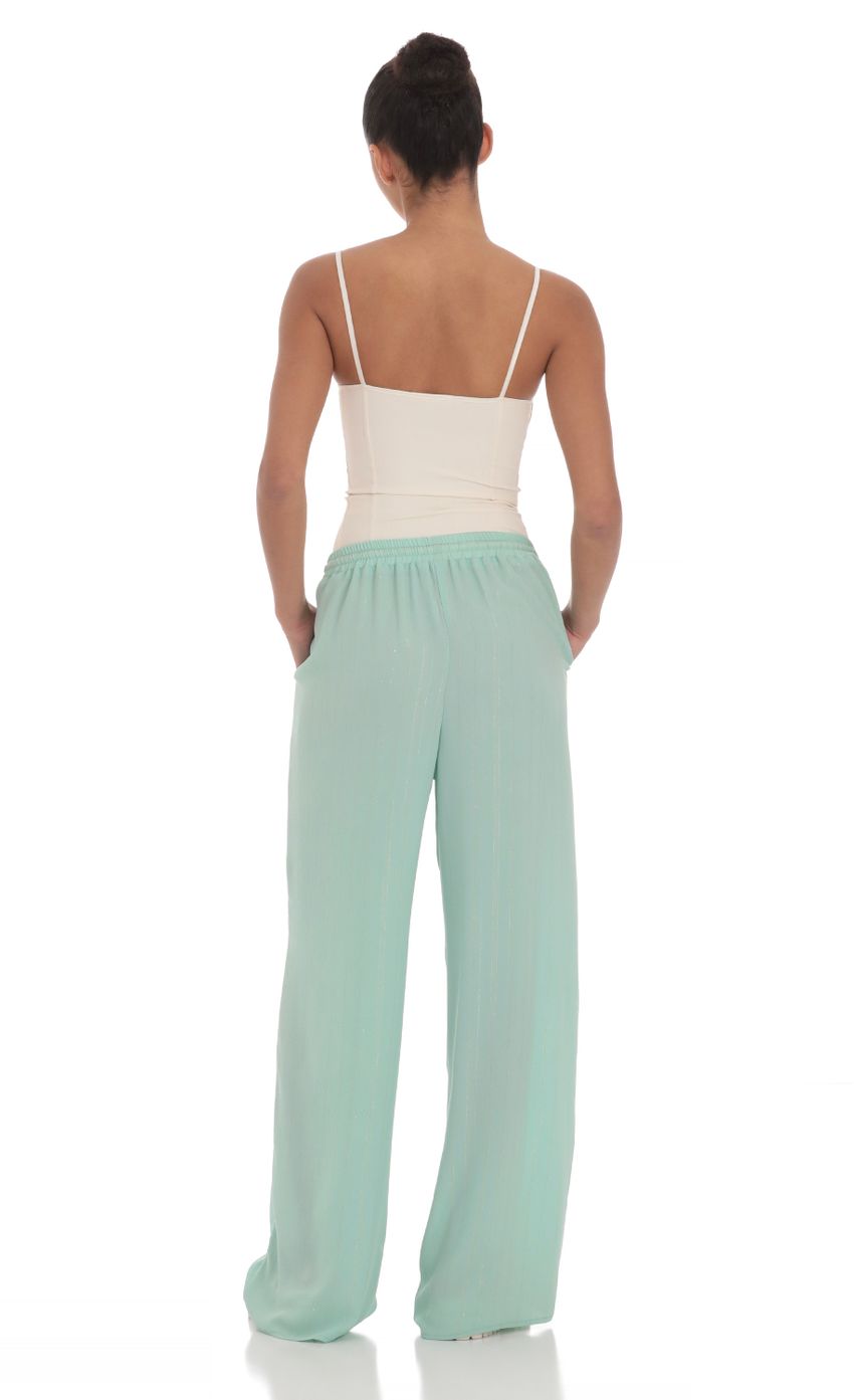 Picture Wide Leg Shimmer Pants in Mint Green. Source: https://media-img.lucyinthesky.com/data/Mar24/850xAUTO/129bb70b-6648-475b-972f-00c51a77cc0e.jpg