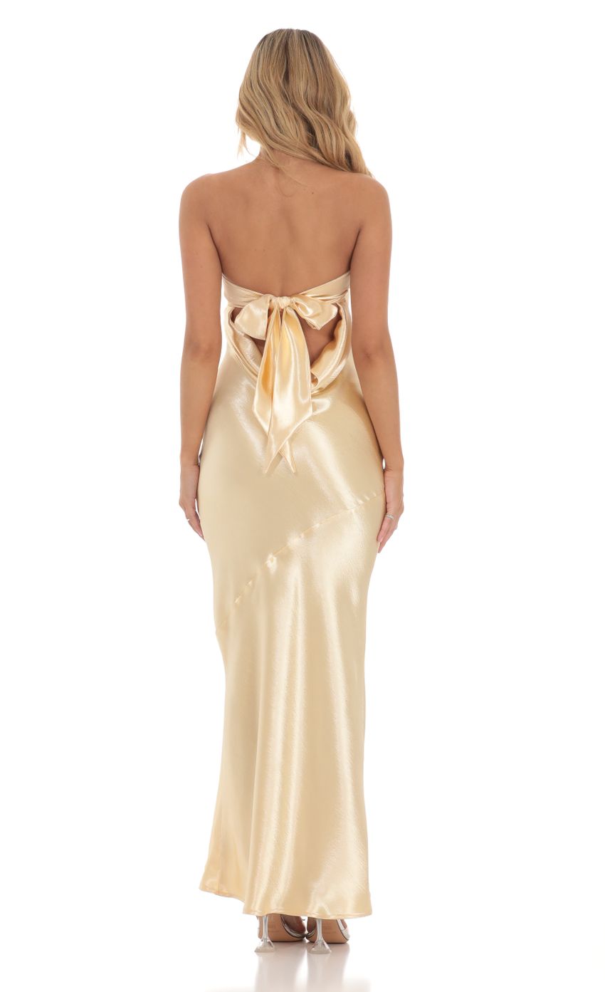 Picture Strapless Satin Open Back Maxi Dress in Gold. Source: https://media-img.lucyinthesky.com/data/Mar24/850xAUTO/138125a5-10ab-4bfe-bdbb-487ab11b7e27.jpg