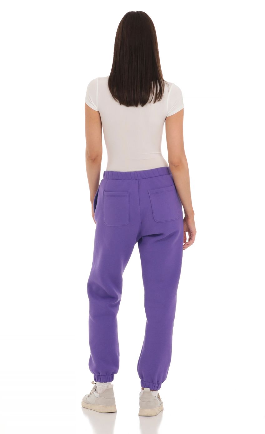 Picture Cinched Sweatpants in Purple. Source: https://media-img.lucyinthesky.com/data/Mar24/850xAUTO/1af0bda0-c05b-4f48-a7aa-91a849440d7e.jpg