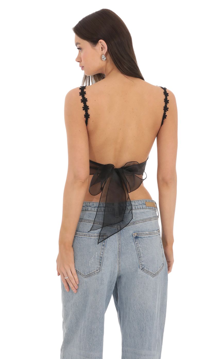 Picture Floral Embroidered Open Back Top in Black. Source: https://media-img.lucyinthesky.com/data/Mar24/850xAUTO/21363c29-a847-439f-921e-9479d705df16.jpg