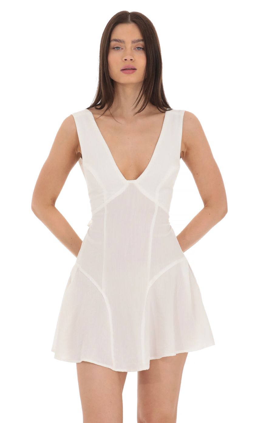 Picture Plunge V-Neck Dress in White. Source: https://media-img.lucyinthesky.com/data/Mar24/850xAUTO/3239e98f-2130-4e01-9541-a573f4b7d54a.jpg