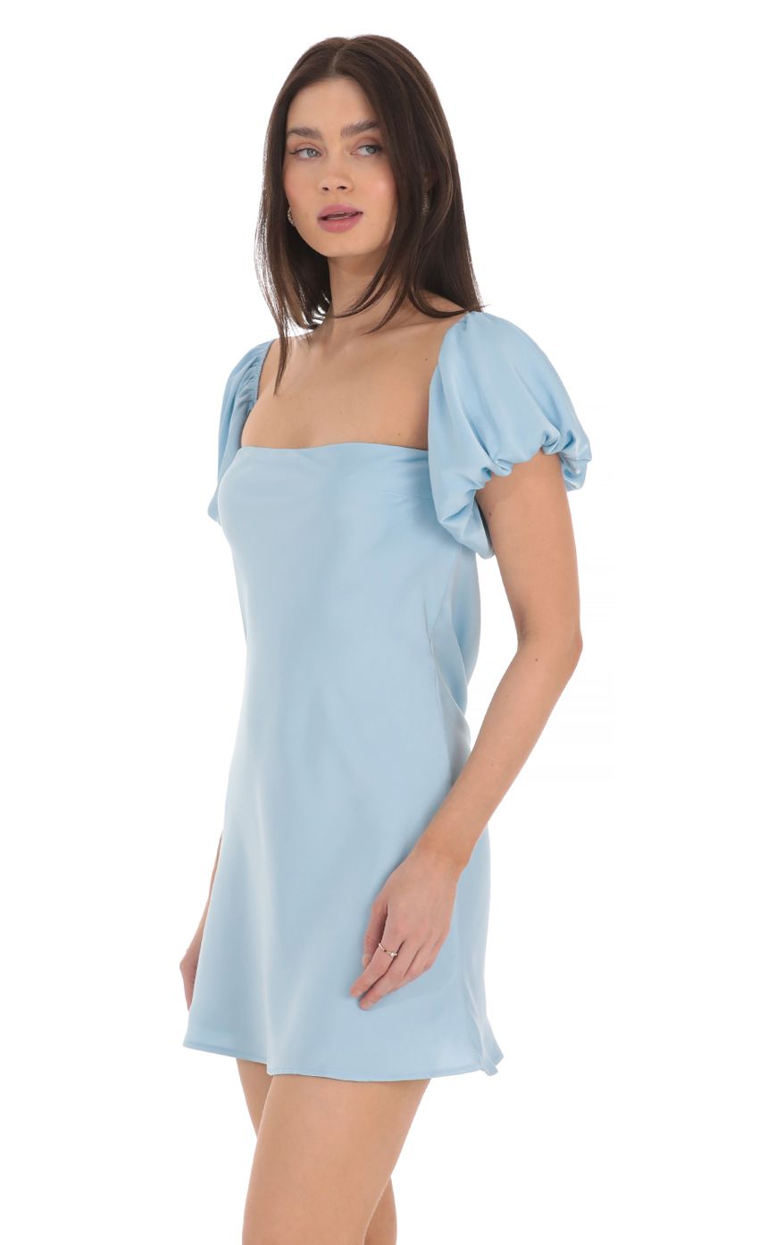 Picture Puff Sleeve Satin Dress in Blue. Source: https://media-img.lucyinthesky.com/data/Mar24/850xAUTO/3ab22c01-6300-4c9d-8b0a-90c50b26054b.jpg