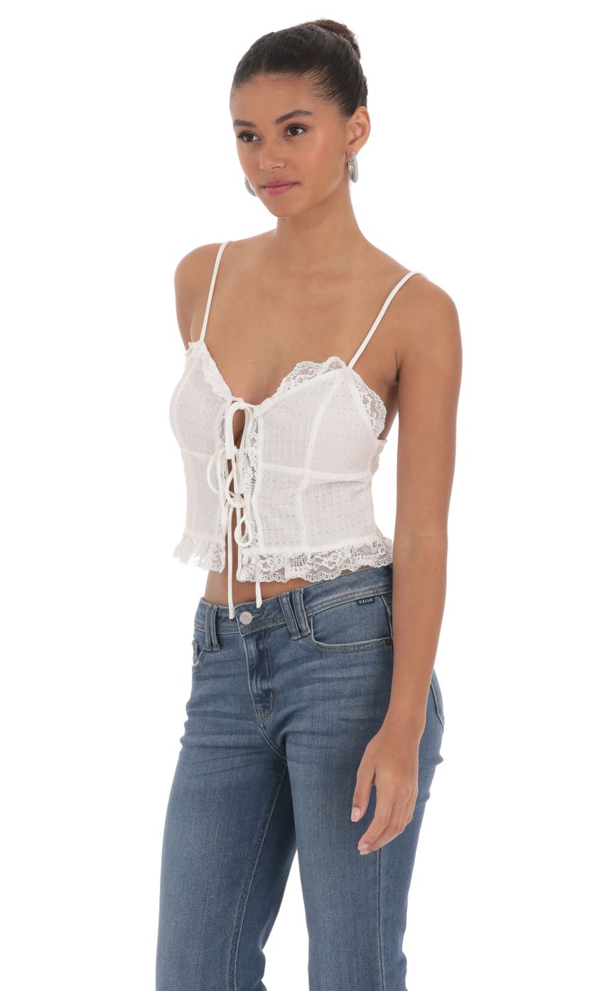 Picture Triple Tie Lace Top in White. Source: https://media-img.lucyinthesky.com/data/Mar24/850xAUTO/4006040a-c2e2-4aa4-893f-756215a53eb7.jpg