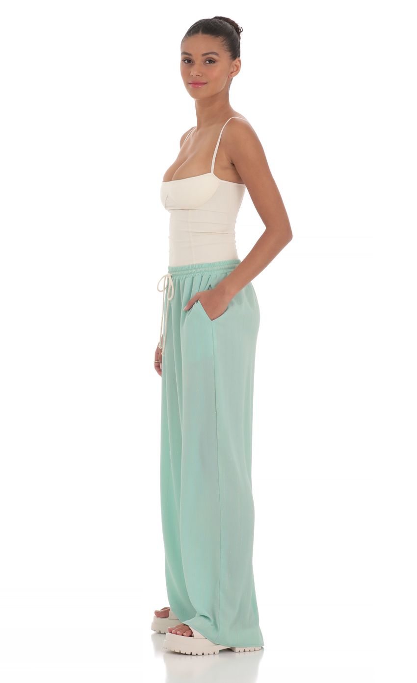 Picture Wide Leg Shimmer Pants in Mint Green. Source: https://media-img.lucyinthesky.com/data/Mar24/850xAUTO/40b4f6e5-451e-46b3-9160-d22ccfff0217.jpg