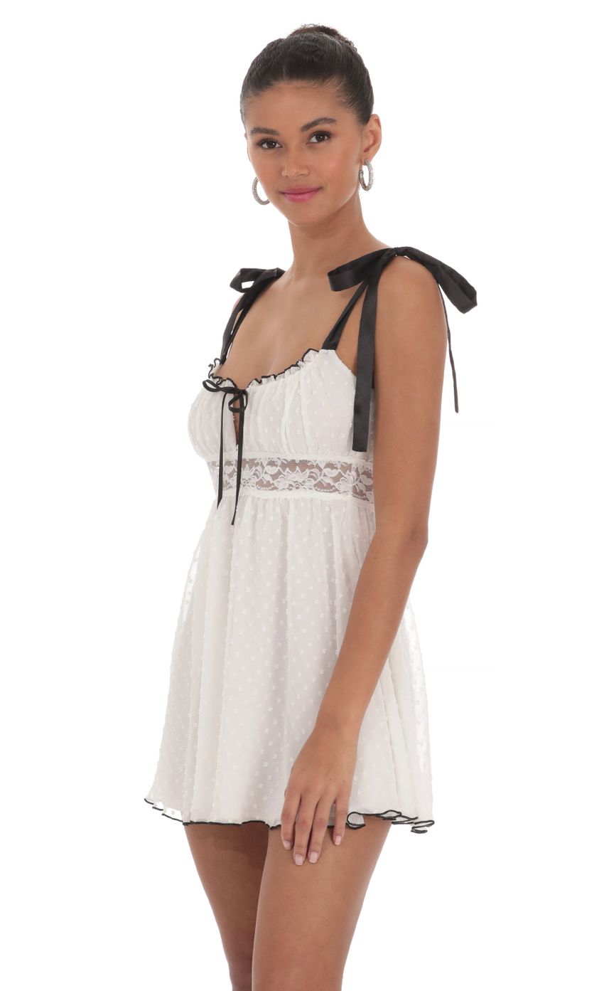 Picture Dotted Lace Babydoll Dress in White. Source: https://media-img.lucyinthesky.com/data/Mar24/850xAUTO/41335928-7d3e-4bac-8593-088ab2a7179a.jpg