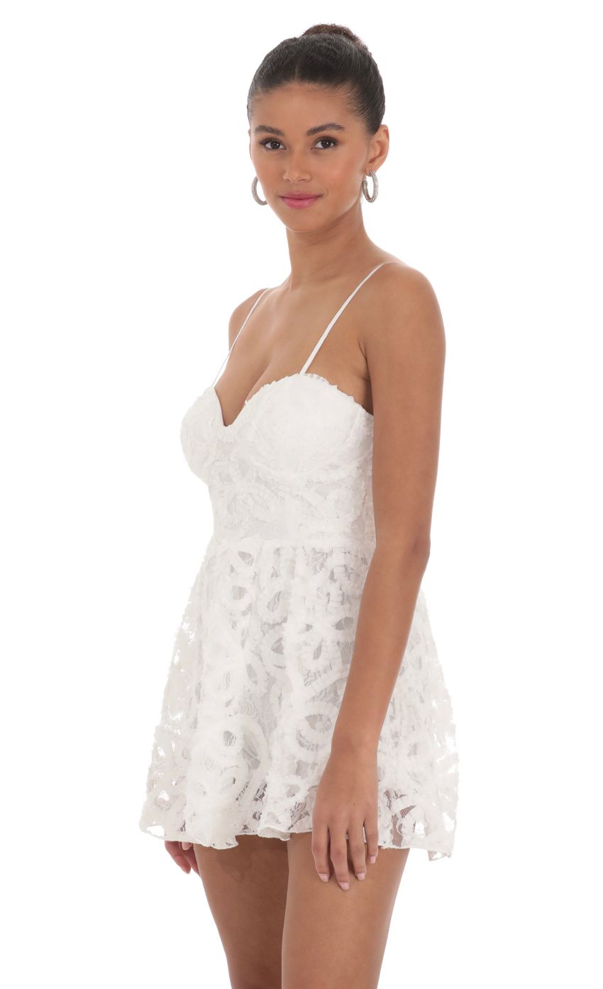 Picture Textured Swirl A-line Romper in White. Source: https://media-img.lucyinthesky.com/data/Mar24/850xAUTO/53697d24-4cf3-49db-9e82-104dc5151966.jpg