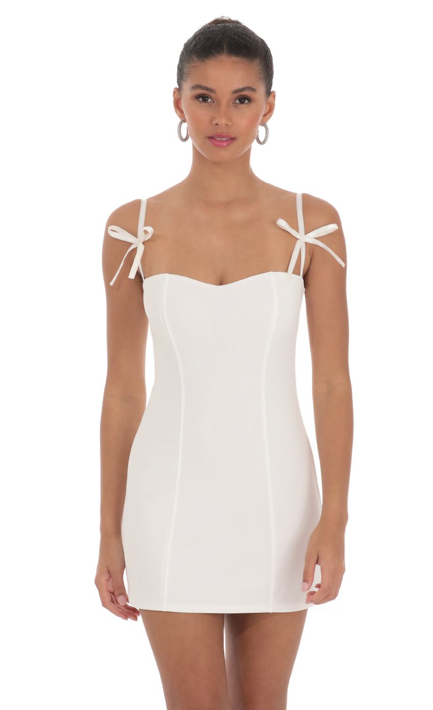 Picture Bow Ties Bodycon Dress in White. Source: https://media-img.lucyinthesky.com/data/Mar24/850xAUTO/5851ab4e-1efc-49b5-9572-676a20b6e370.jpg