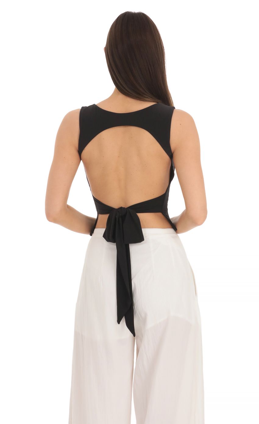 Picture Scoop Neck Open Back Top in Black. Source: https://media-img.lucyinthesky.com/data/Mar24/850xAUTO/5a3f6a74-5b84-4054-a020-c9582b6959f3.jpg