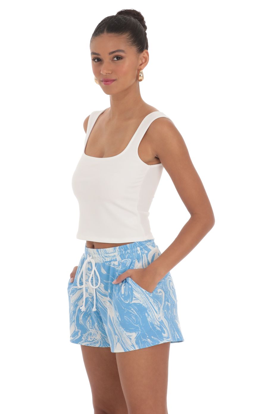 Picture Swirl Sweat Shorts in Blue. Source: https://media-img.lucyinthesky.com/data/Mar24/850xAUTO/5d896b38-c769-40e0-a6a2-983ff2012cc1.jpg