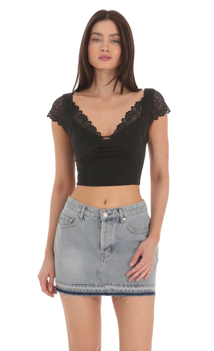Picture Lace Sleeve Top in Black. Source: https://media-img.lucyinthesky.com/data/Mar24/850xAUTO/67405df2-5213-477b-9028-639c6e386c61.jpg