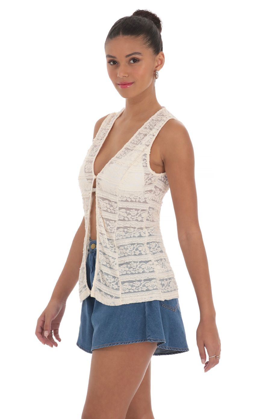 Picture Lace Vest in Cream. Source: https://media-img.lucyinthesky.com/data/Mar24/850xAUTO/6ecf346f-eb02-436f-9f92-0fb7571bf915.jpg