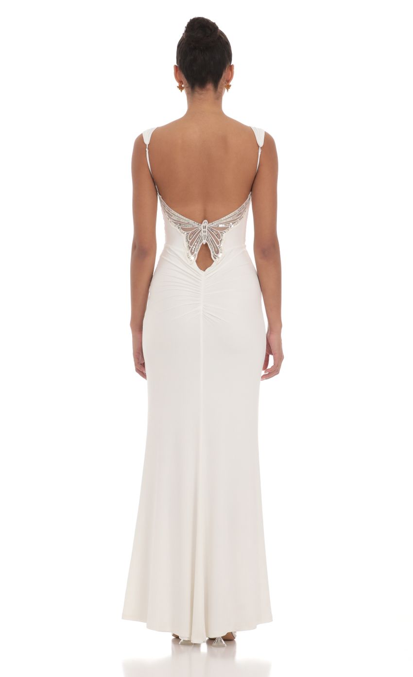Picture Back Sequin Butterfly Maxi Dress in White. Source: https://media-img.lucyinthesky.com/data/Mar24/850xAUTO/7041d1c3-6099-4082-bd78-5f6ed9b607f1.jpg