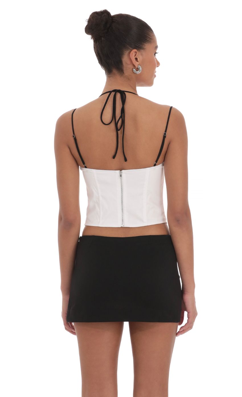 Picture Lace Halter Top in White. Source: https://media-img.lucyinthesky.com/data/Mar24/850xAUTO/70e264a8-b3e6-41ad-859d-8ddc565dfaa6.jpg