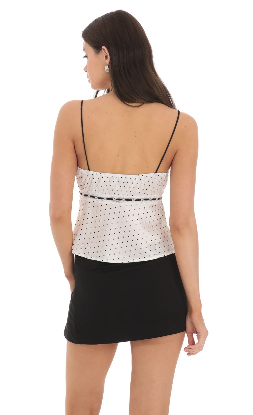 Picture Polka Dot Satin Top in White. Source: https://media-img.lucyinthesky.com/data/Mar24/850xAUTO/726f906e-62d7-4af2-a729-19b4b39ca6d7.jpg