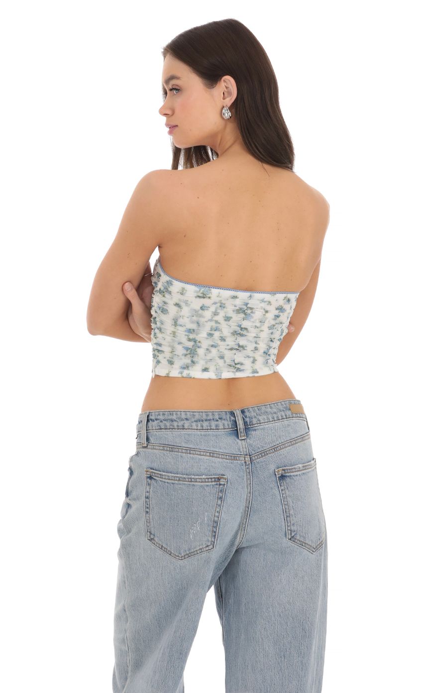 Picture Strapless Ruched Floral Top in White. Source: https://media-img.lucyinthesky.com/data/Mar24/850xAUTO/76190cc0-5389-40f7-adef-4d67b804a431.jpg
