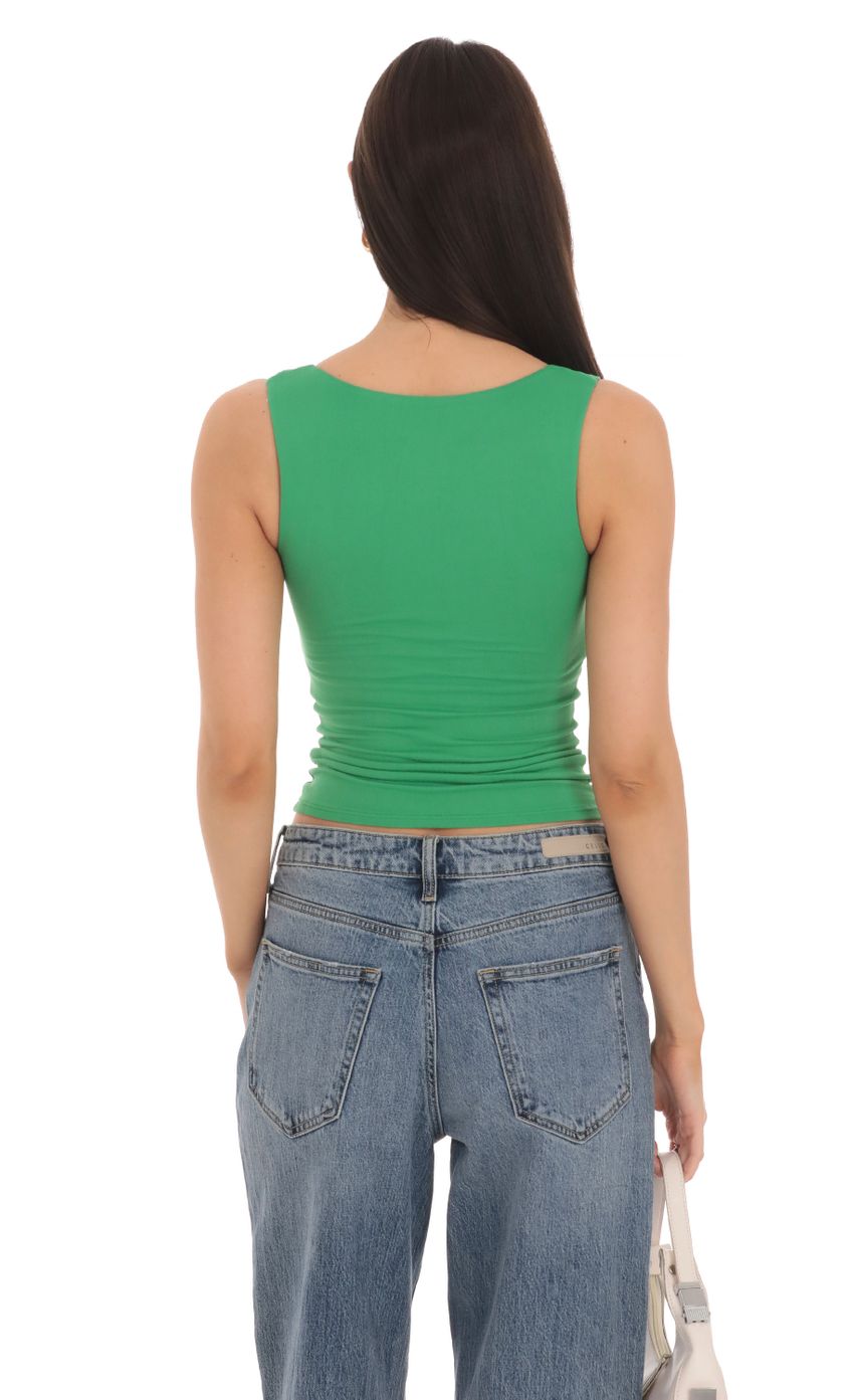 Picture Scoop Neck Tank Top in Green. Source: https://media-img.lucyinthesky.com/data/Mar24/850xAUTO/9312c149-c3a4-4861-9163-3425be293e19.jpg