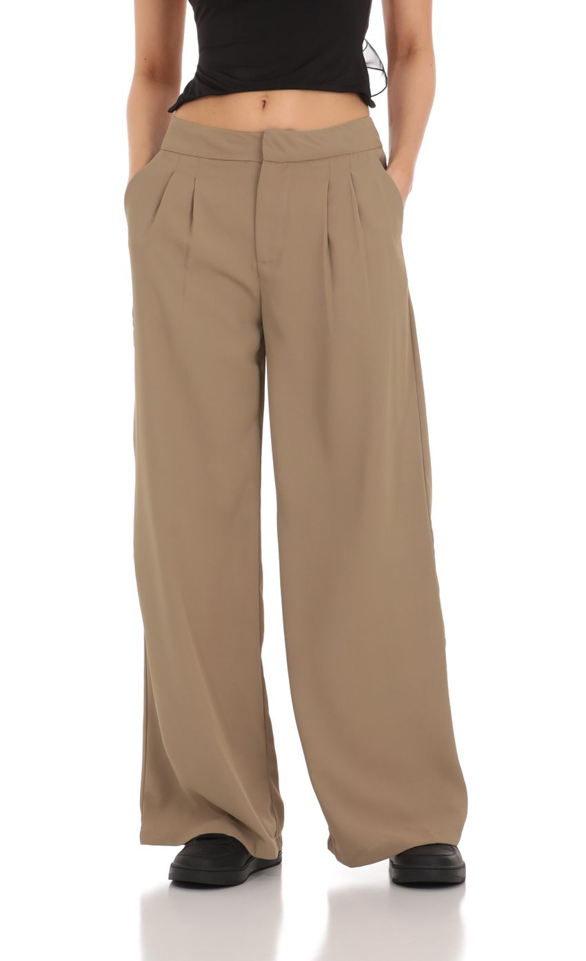 Picture Pleated Wide Leg Trousers in Taupe. Source: https://media-img.lucyinthesky.com/data/Mar24/850xAUTO/93e72d50-6633-4e48-8ec4-6de1ccfa7b21.jpg