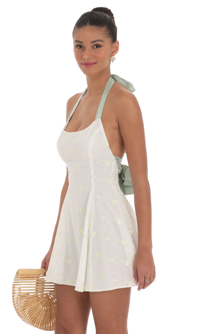 Picture Halter Floral Embroidered Open Back Dress in White. Source: https://media-img.lucyinthesky.com/data/Mar24/850xAUTO/971b6554-6354-4525-8f24-0d8a0e71d349.jpg