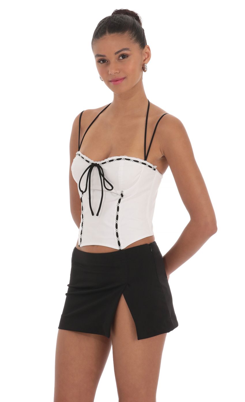 Picture Lace Halter Top in White. Source: https://media-img.lucyinthesky.com/data/Mar24/850xAUTO/9a79b0b3-d8cf-480c-a7b6-0121e5751b31.jpg