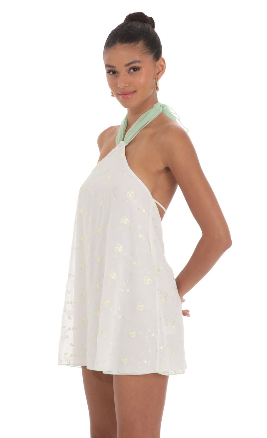 Picture Floral Halter Shift Dress in White. Source: https://media-img.lucyinthesky.com/data/Mar24/850xAUTO/9b0b3a64-2661-4136-8552-4094ea7ac838.jpg