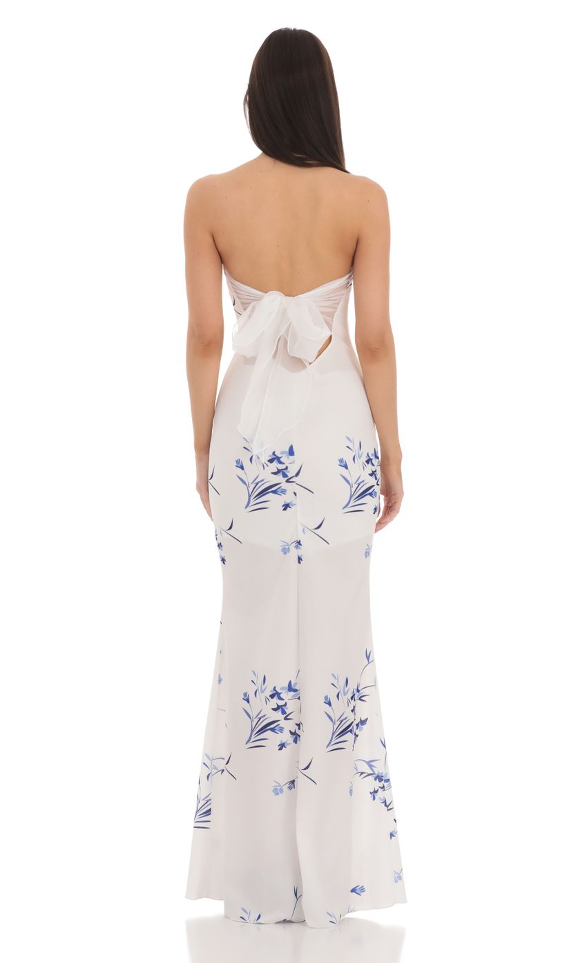 Picture Floral Back Bow Strapless Maxi Dress in White. Source: https://media-img.lucyinthesky.com/data/Mar24/850xAUTO/aaf4c662-ab71-41dc-a11d-83fe663990ea.jpg